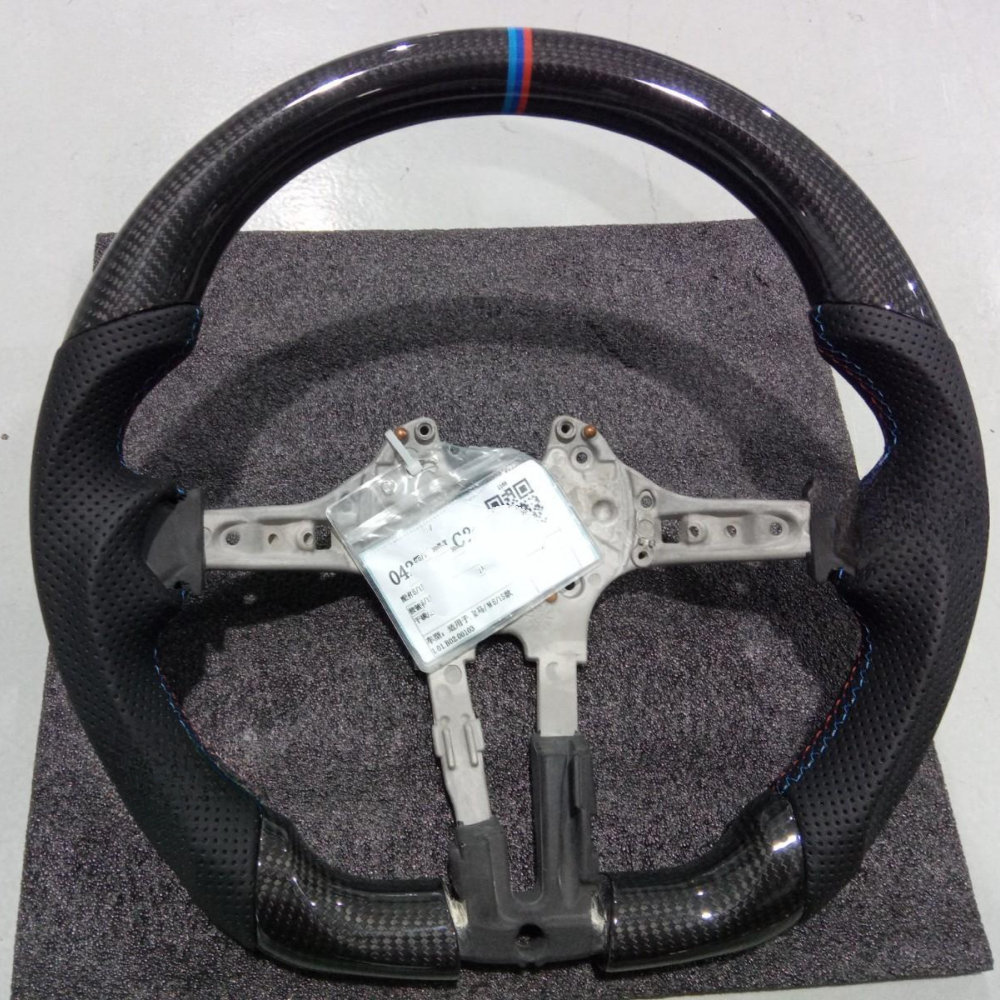 Vekto real carbon fiber M Sport steering wheel for BMW 5, 6, 7 Series, M5, and M8 with sporty design and textured finish.