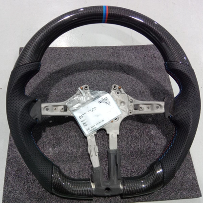 Vekto real carbon fiber M Sport steering wheel for BMW 5, 6, 7 Series, M5, and M8 with sporty design and textured finish.