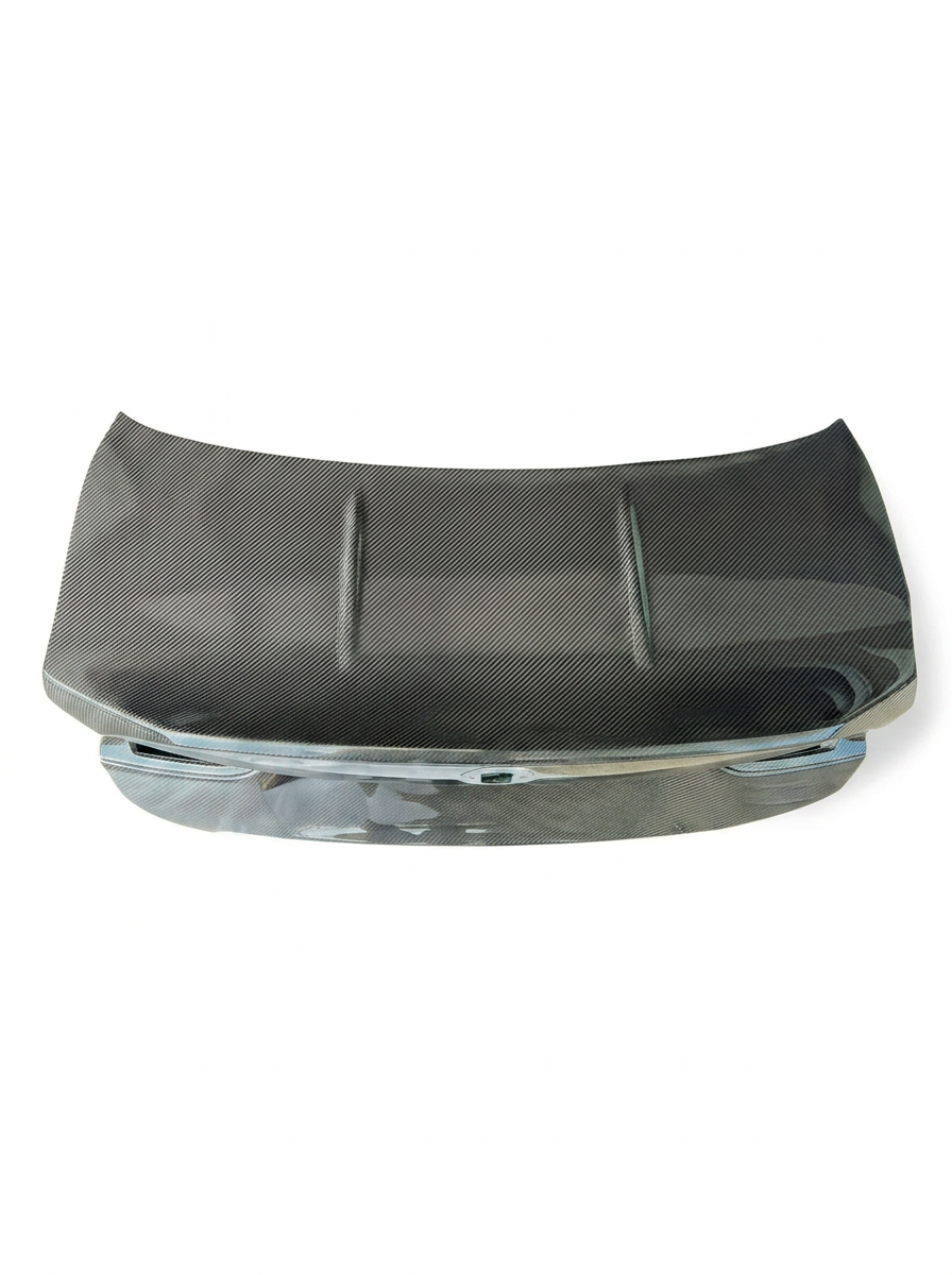 BMW 4 Series G82 carbon fiber CSL trunk by K2 Industries, showcasing sleek, lightweight design with a smooth, glossy finish.