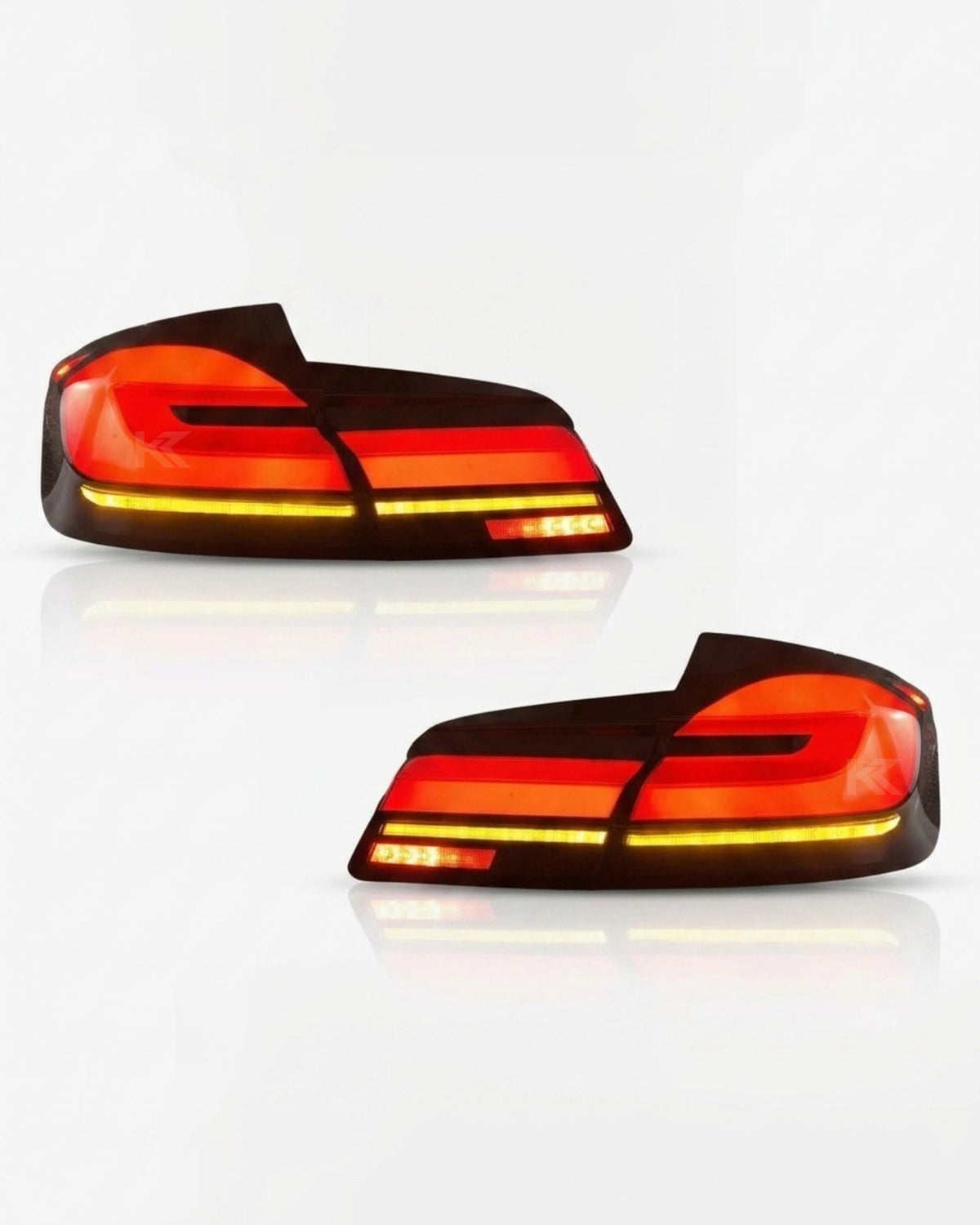 BMW 5-Series F10 F18 clear tail lights with G30 style, installed on a 2011-2017 model, showcasing modern LED design by K2 Industries