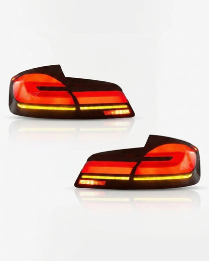 BMW 5-Series F10 F18 clear tail lights with G30 style, installed on a 2011-2017 model, showcasing modern LED design by K2 Industries