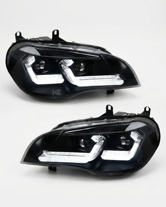 BMW X5 E70 headlights with K2 Industries "TRON" LED headlight design, showcasing sleek LED light strips and modern headlamp features.