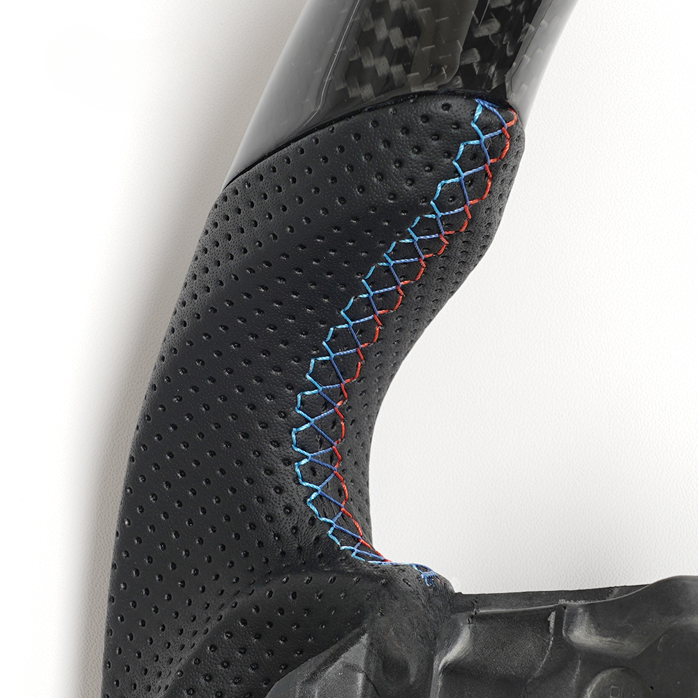 Vekto carbon fiber steering wheel for BMW G series M Sport G30 G05 G11, showing close-up of textured black carbon fiber surface.