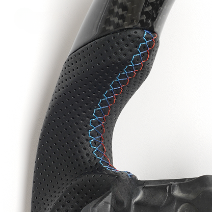 Vekto carbon fiber steering wheel for BMW G series M Sport G30 G05 G11, showing close-up of textured black carbon fiber surface.