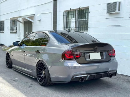 BMW 3 Series E90 M3 GTS OLED tail lights by K2 Industries showing close-up of sleek red and clear LED lighting elements.