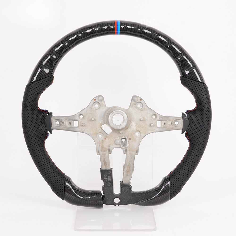 Vekto carbon fiber steering wheel for BMW F30 F-Series, close-up view showing textured carbon fiber surface and ergonomic design.