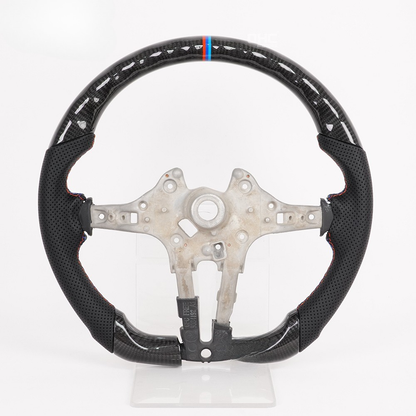Vekto carbon fiber steering wheel for BMW F30 F-Series, close-up view showing textured carbon fiber surface and ergonomic design.