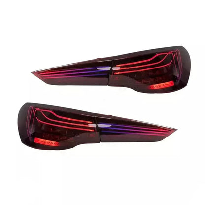 RGB CSL style OLED tail lights for BMW G22 G23 G26 G82 G83 M4 by Vekto, showing sleek LED tail light design on the vehicle.