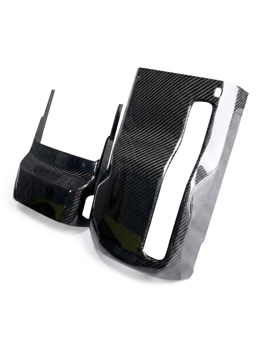 BMW 3 Series G80 G81 M3 and 4 Series G82 G83 M4 carbon fiber steering column cover by K2 Industries, showing sleek black finish.