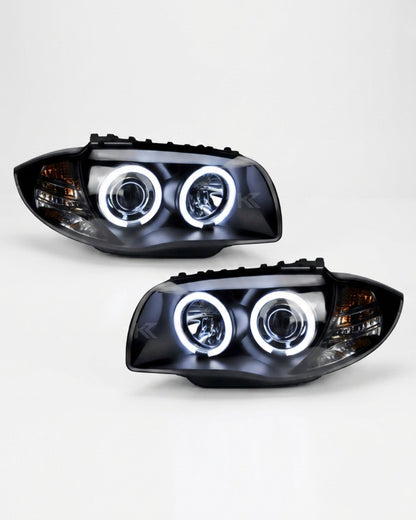 BMW 1 Series 120i 118i E87 headlights with angel eyes LED lights, branded by K2 Industries, showing the front view of the headlights.