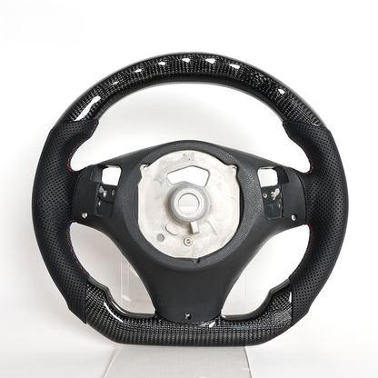 Vekto LED carbon fiber steering wheel for BMW E90 E92 E93 M3, 328i, 335i featuring paddle shifter cutouts and sporty design.