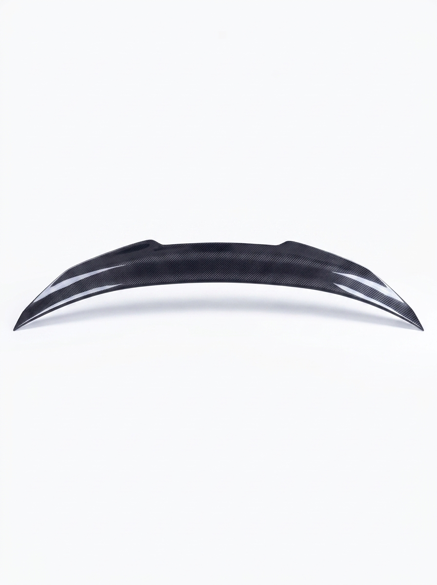 BMW 4 Series F82 M4 carbon fiber trunk spoiler by K2 Industries, showcasing a sleek, aerodynamic design on a black car.