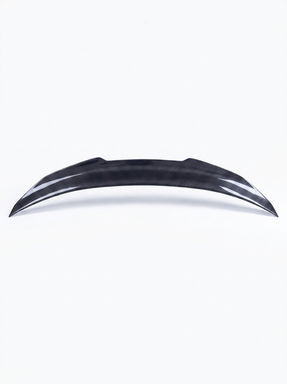 BMW 4 Series F82 M4 carbon fiber trunk spoiler by K2 Industries, showcasing a sleek, aerodynamic design on a black car.