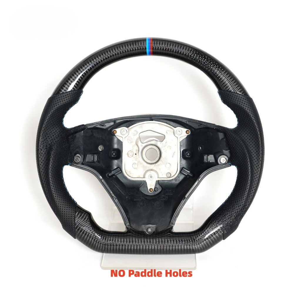 Vekto real carbon fiber steering wheel for BMW E90 E92 E93 M3 328i 335i 135i 2009-2013, close-up of textured carbon fiber surface