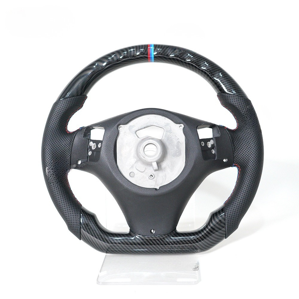 Vekto Hydro-Dip carbon steering wheel for BMW E90/E92/E93 M3 2006-2013, showing the textured carbon finish on the steering rim.