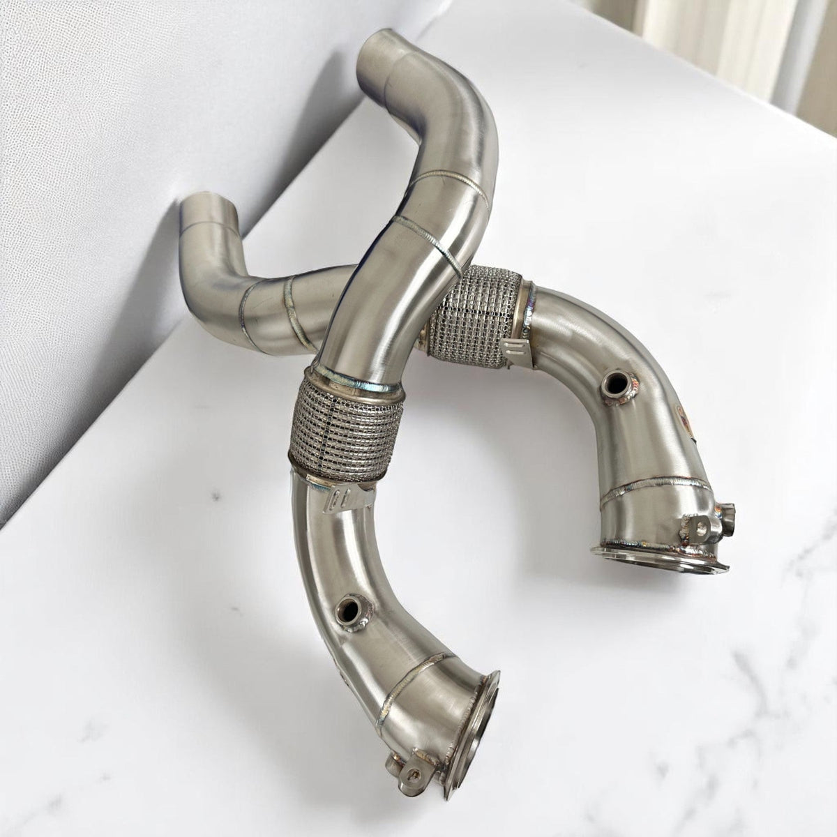 BMW N63R & N63B catless race downpipes for M550i, 750i, M850i, X5, X6, X7 by Palenon Performance, showing sleek metal design.