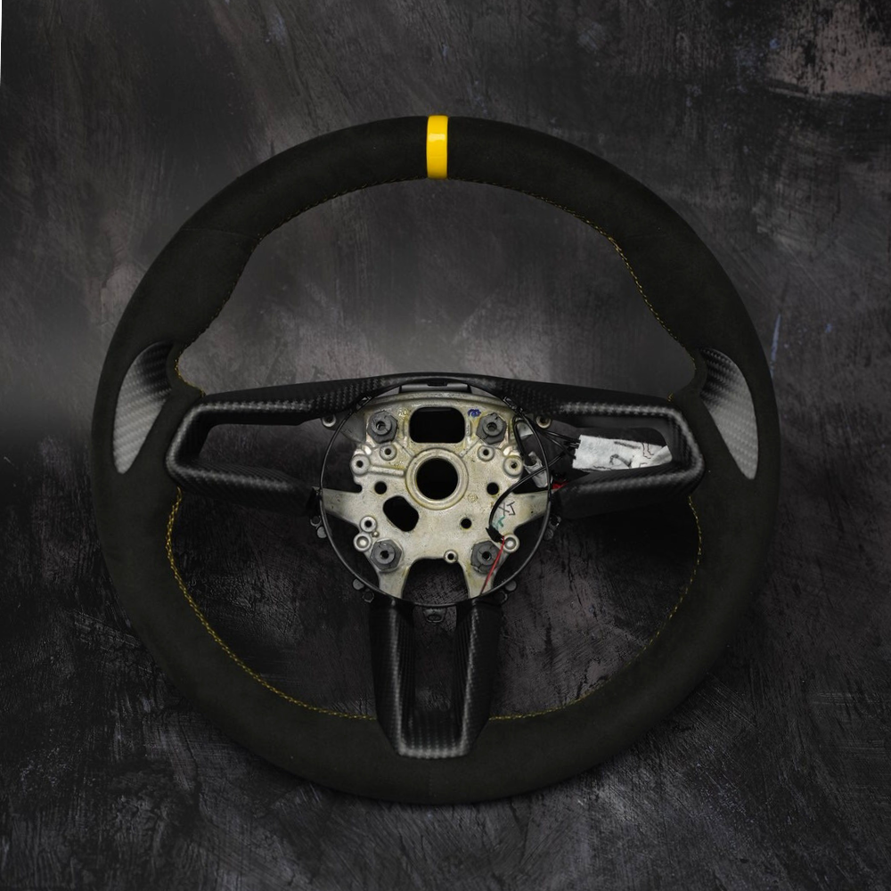 Custom Porsche 911 (992), Taycan, Macan steering wheel by Exclusive Steering, showcasing premium leather and stylish design.