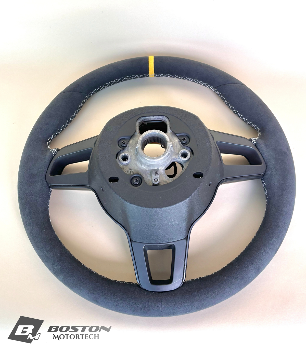 Yellow manual Porsche 991.2 steering wheel by Boston Motortech with black accents and detailed grip design.