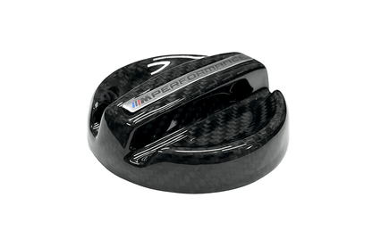 BMW MPerformance carbon fiber engine oil cover by K2 Industries, showcasing a sleek, lightweight carbon fiber oil cap for engine upgrade.
