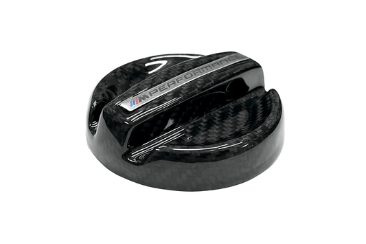 BMW MPerformance carbon fiber engine oil cover by K2 Industries, showcasing a sleek, lightweight carbon fiber oil cap for engine upgrade.