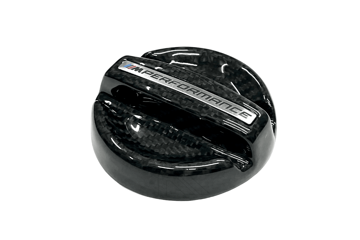 BMW MPerformance carbon fiber engine oil cover by K2 Industries, sleek carbon fiber engine oil cap for BMW vehicles.