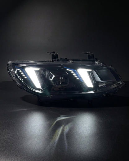 BMW 3 Series M3 E92 E93 LED headlight assembly with dual-color DRL, black housing, and snake eye design for 2010-2013 models.
