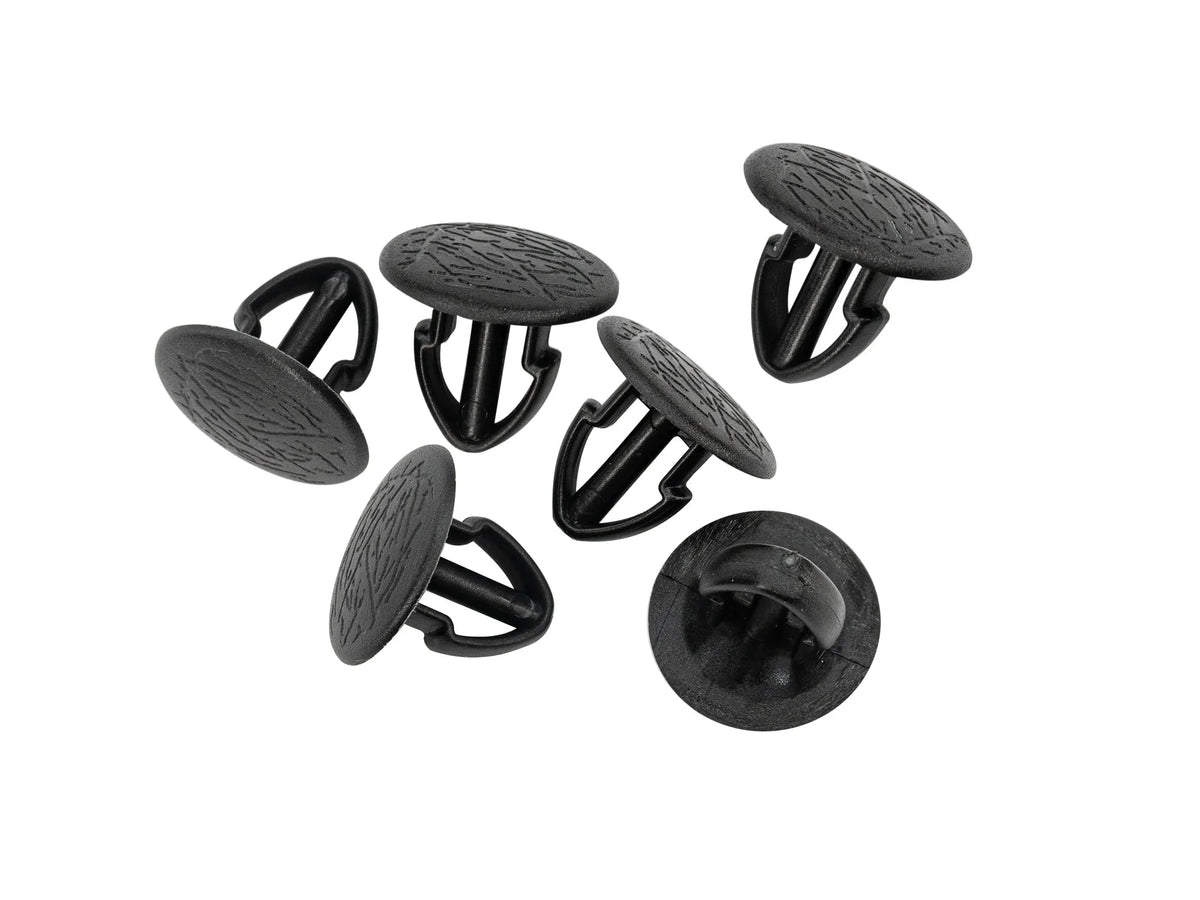 Six GoWesty Panel Clips with exposed heads for early Vanagon body panel installation, part of vehicle body parts collection.