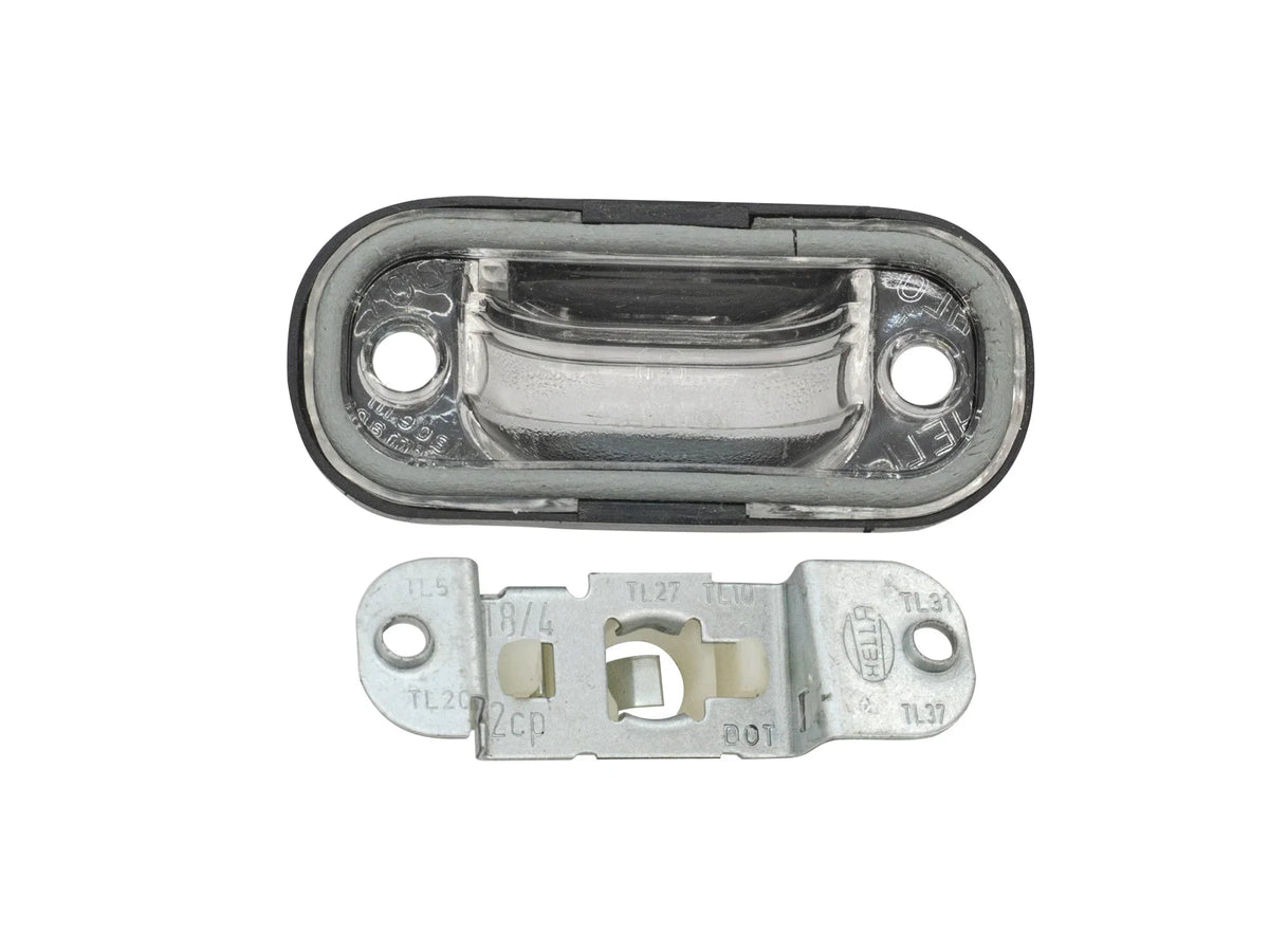 GoWesty license plate light bulb holder and lens for Vanagon, showcasing the lighting component with clear lens and mounting details.
