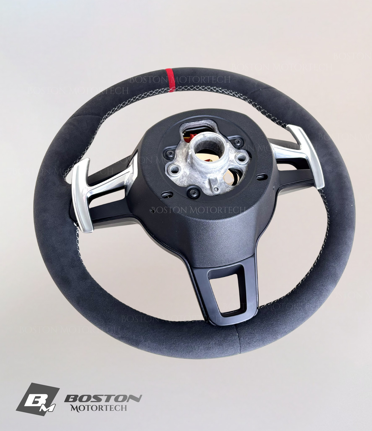 Red Porsche 991.2 steering wheel by Boston Motortech with sporty design and detailed grip, designed for Porsche 911 models.