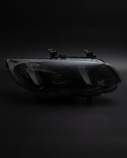 K2 Industries BMW 3 Series M3 E92/E93 LED headlight assembly with dual-color DRL, 2010-2013, featuring snake eye LCI design.