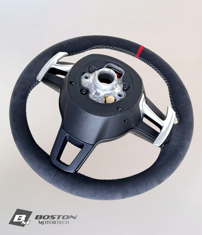 Red PDK Porsche 991.2 steering wheel by Boston Motortech, featuring black grip accents and integrated control buttons.