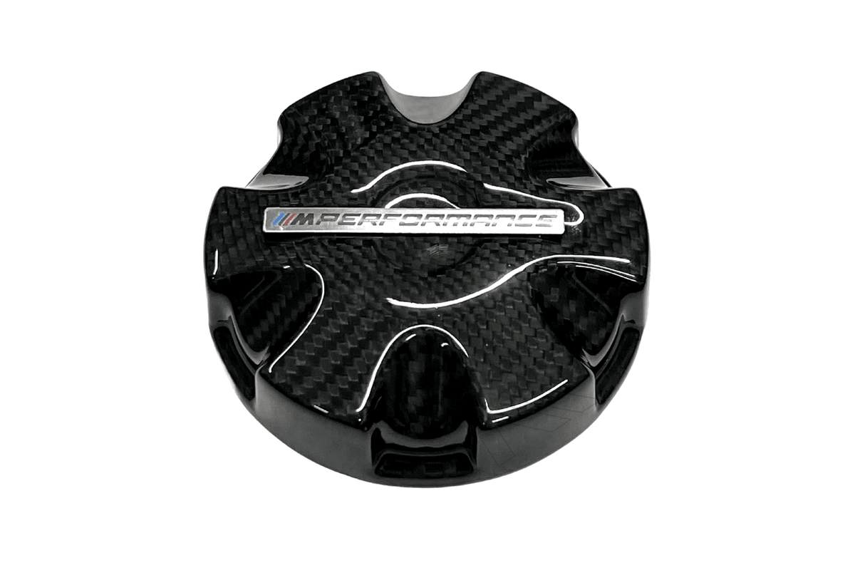 BMW MPerformance carbon fiber radiator cap cover by K2 Industries, showcasing sleek black carbon fiber with detailed branding.