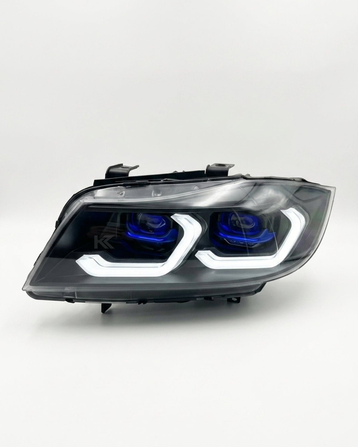 BMW 3 Series E90 LED headlight assembly with dual-color daytime running lights, manufactured by K2 Industries, for 2005-2012 models.