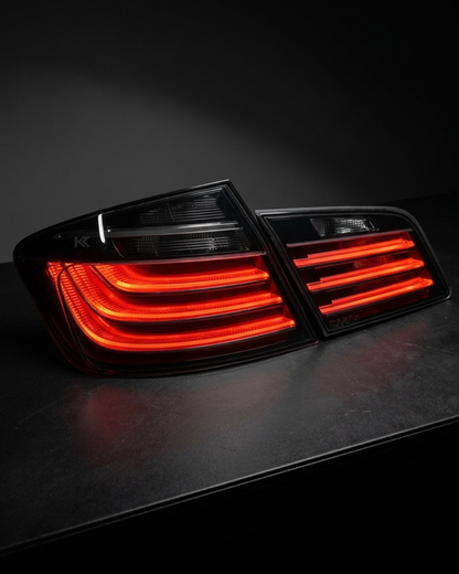 BMW 5 Series F10 BlackLine Style LED tail lights by K2 Industries, featuring sleek black housing and LED illumination.