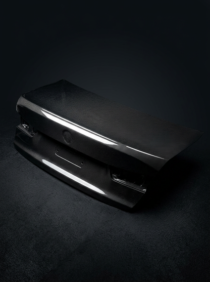 BMW 3 Series G80 M3 OEM Style carbon fiber trunk by K2 Industries, with a sleek, glossy finish and aerodynamic design.