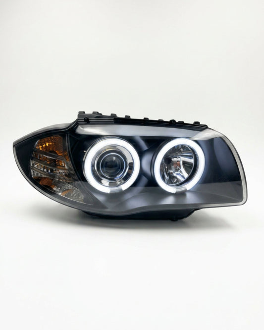 BMW 1 Series 120i 118i E87 headlights with LED angel eyes from K2 Industries, showing the front view of the headlights.