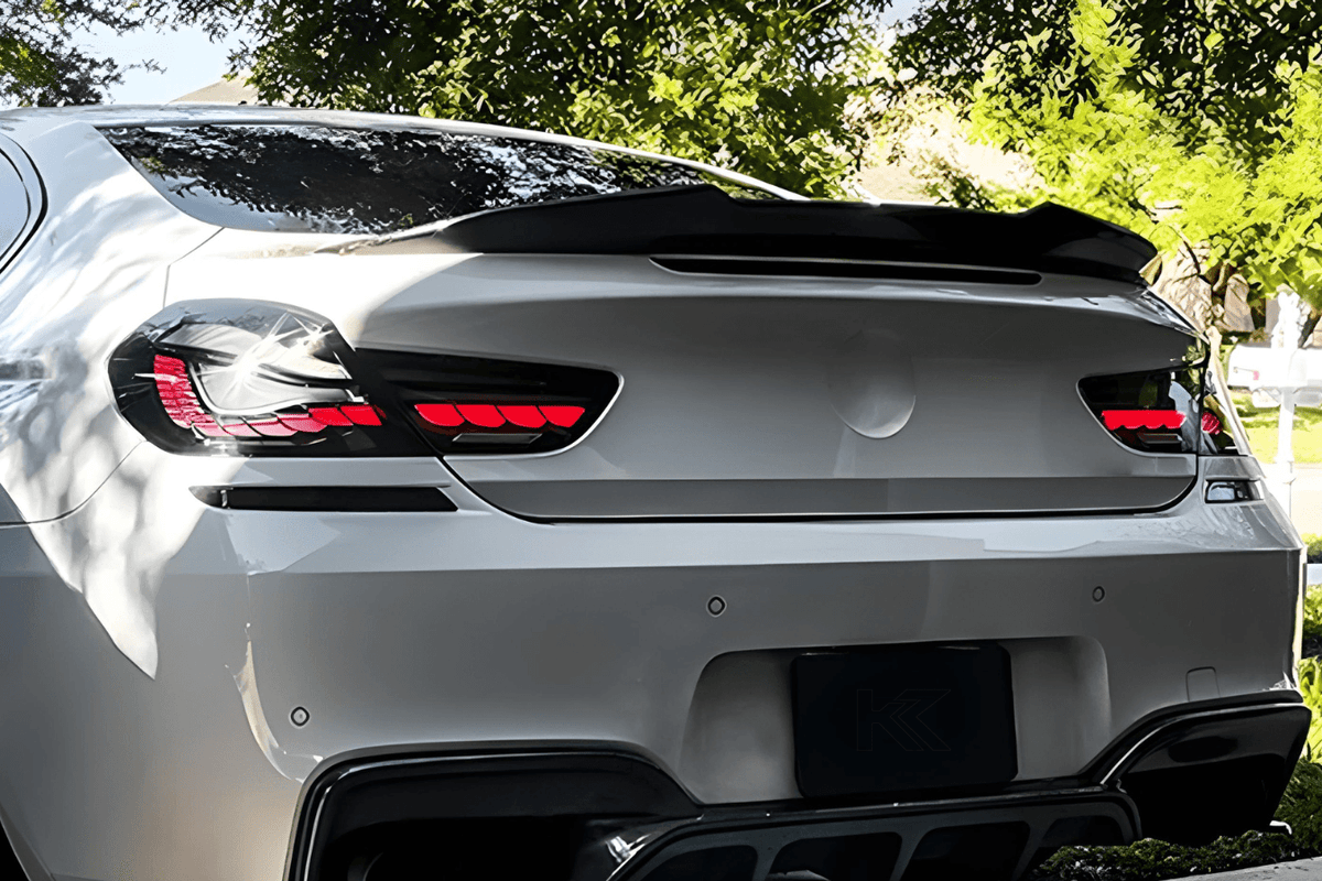 BMW 6 Series F12 F13 F06 smoke and red GTS OLED style tail lights by K2 Industries, showing sleek design and vibrant LED illumination.