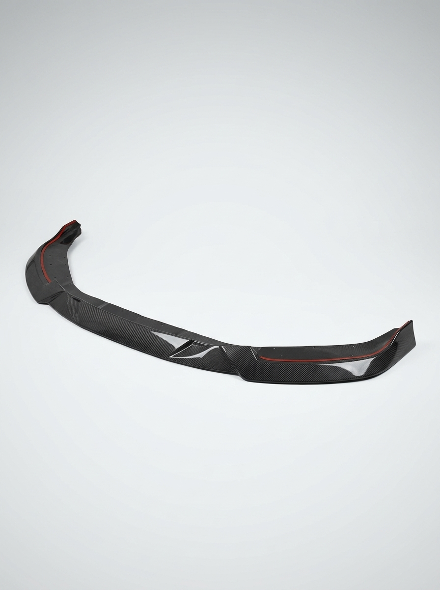 BMW 2 Series G87 M2 MHC Style carbon fiber front lip by K2 Industries, showcasing sleek aerodynamic design and textured finish.