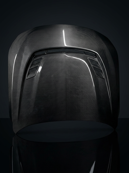 BMW 2 Series G87 M2 carbon fiber hood by K2 Industries, showcasing sleek, lightweight carbon fiber with detailed venting.