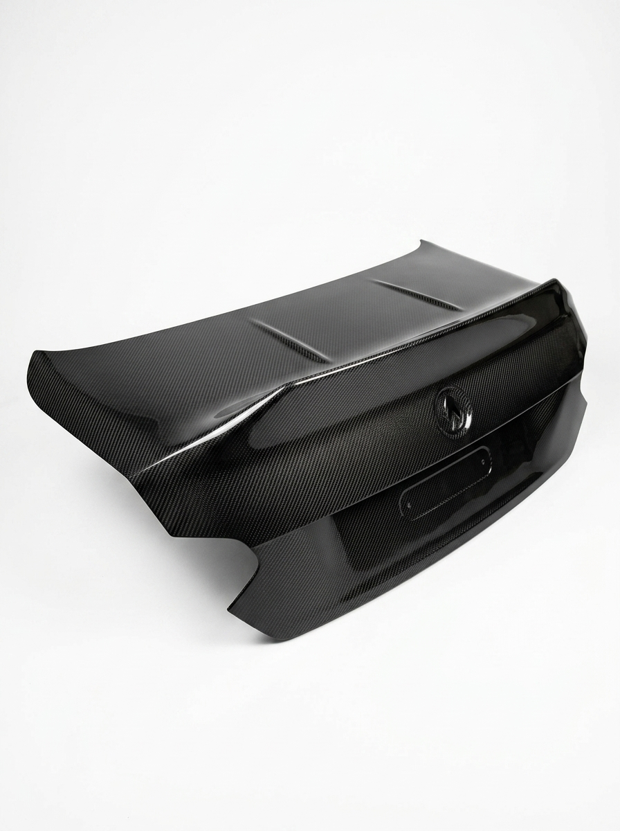 BMW 2 Series G42 M240i CSL dry carbon fiber trunk by K2 Industries, featuring sleek carbon fiber surface and aerodynamic design.