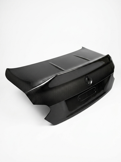 BMW 2 Series G42 M240i CSL dry carbon fiber trunk by K2 Industries, featuring sleek carbon fiber surface and aerodynamic design.