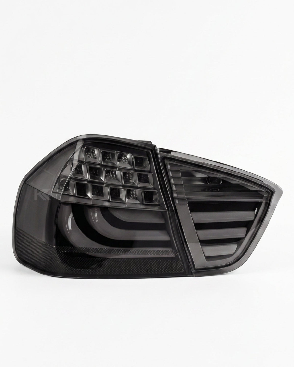 BMW 3-Series E90 tail light upgrade by K2 Industries, showing sleek red and clear tail lights for 2006-2009 models.