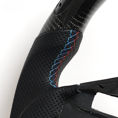 Vekto LED carbon fiber steering wheel with paddle shifter cutouts for BMW E90, E92, E93 M3, 328i, and 335i models.