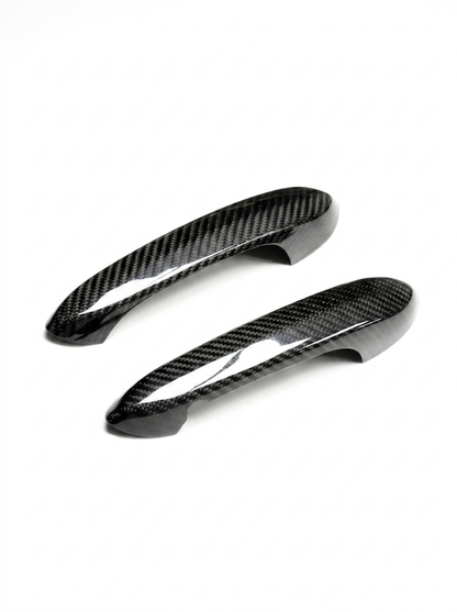 BMW 4 Series G82 M4 carbon fiber door handle cover by K2 Industries, sleek black textured finish, fits 2021+ models.