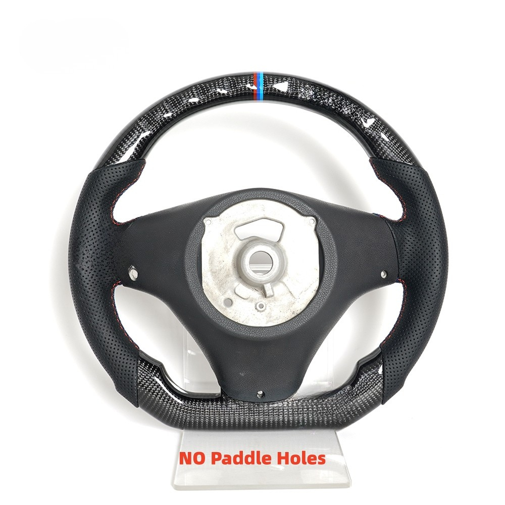 Vekto real carbon fiber steering wheel for BMW E90 E92 E93 M3, 328i, 335i, and 135i 2009-2013, close-up view of textured surface