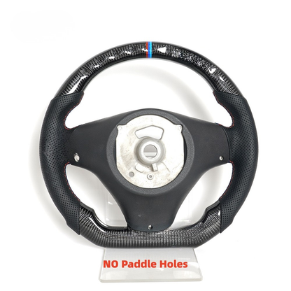 Vekto real carbon fiber steering wheel for BMW E90 E92 E93 M3, 328i, 335i, and 135i 2009-2013, close-up view of textured surface