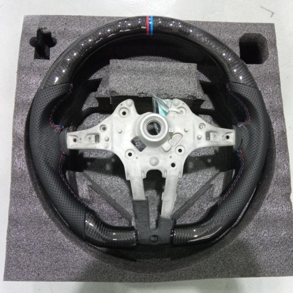 Vekto carbon fiber steering wheel for BMW F30 F-Series, close-up view of sleek, lightweight steering wheel with textured finish