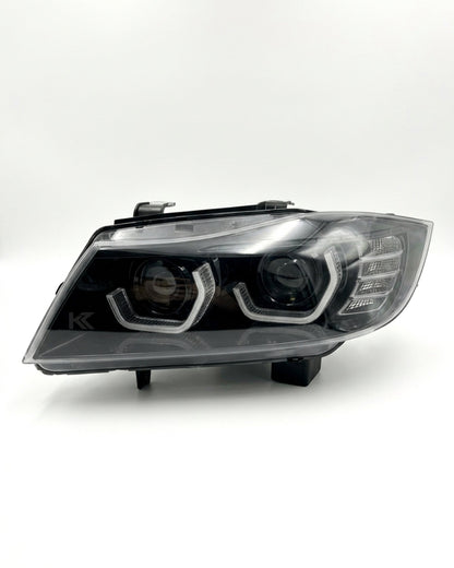 K2 Industries BMW 3-Series E90/E91 "TRON" headlights for 2005-2012, showing sleek design and clear lens details.
