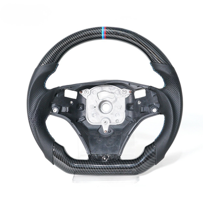 Vekto Hydro-Dip Carbon steering wheel for BMW E90/E92/E93 M3 2006-2013, showing a close-up of the textured black and carbon finish.