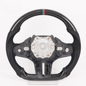 Vekto M Sport carbon fiber steering wheel for BMW G Series with sporty design and textured grip in close-up view